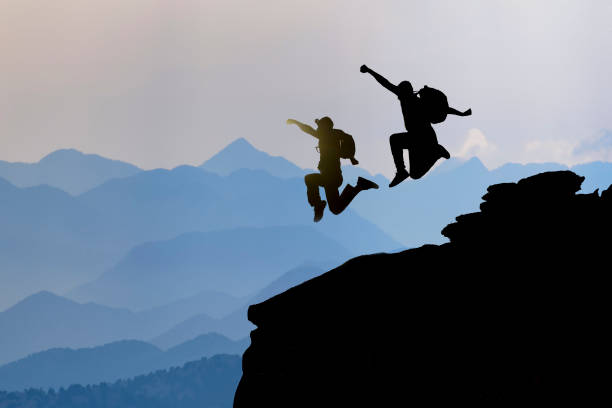 istock peak success of crazy, energetic and dynamic climbers 1063630704