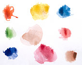 Watercolor paints on a white piece of paper ready to use