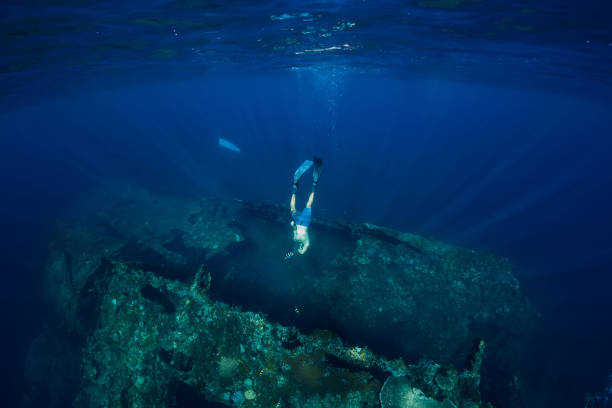 istock Free diver man dive at USS Liberty Wreck, Bali 1063635904