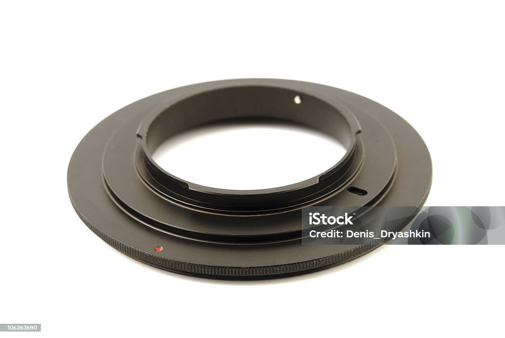 Macro reverse ring for DSLR  SLR camera Macro reverse ring for DSLR  SLR camera on  white background Aperture Stock Photo