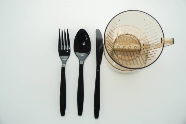 istock top view of isolated plastic cutlery utensils with creative design water mug 1063638668