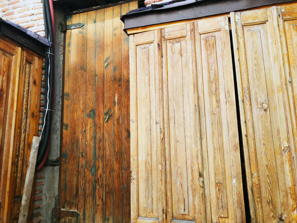 istock Old Tbilisi architecture, wooden doors exterior decor in summer day 1063645438