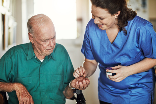 Cropped shot of a female nurse assisting her senior male patient