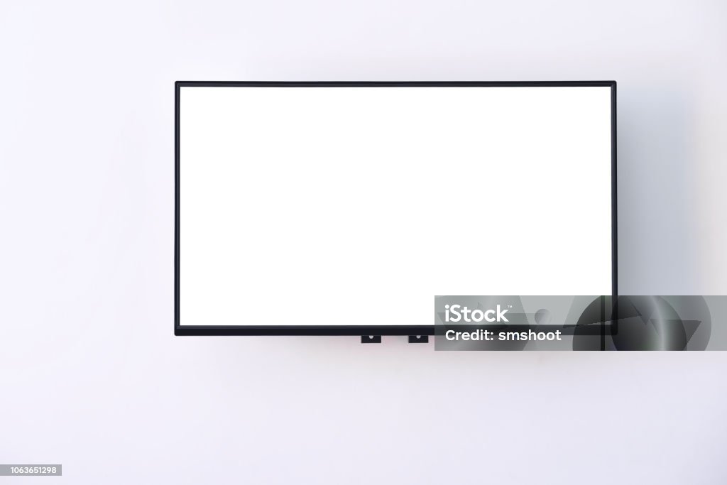 White wide screen TV digital hanging on white wall background Copy space and input text idea Television Industry Stock Photo