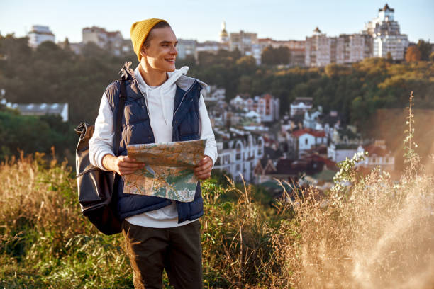 istock Young tourist blogger is exploring the map 1063652570