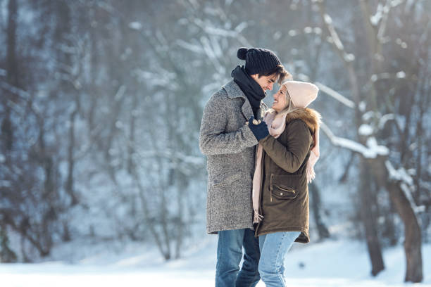 istock Two young people enjoying in the snow 1063653834
