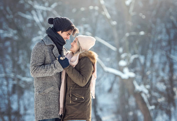 Two young people enjoying in the snow