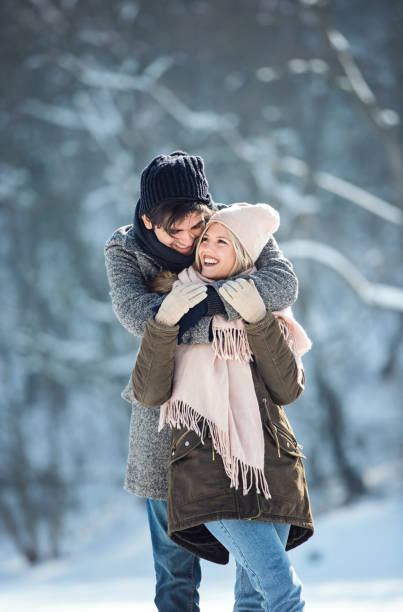 istock Two young people enjoying in the snow 1063654132