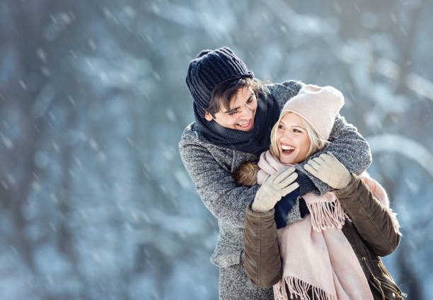 istock Two young people enjoying in the snow 1063654220
