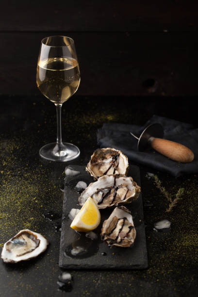 Fresh oysters with lemon and a glass of wine