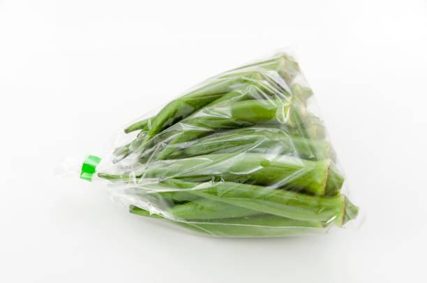 istock fresh okra in plastic bag isolated white background. 1063654648