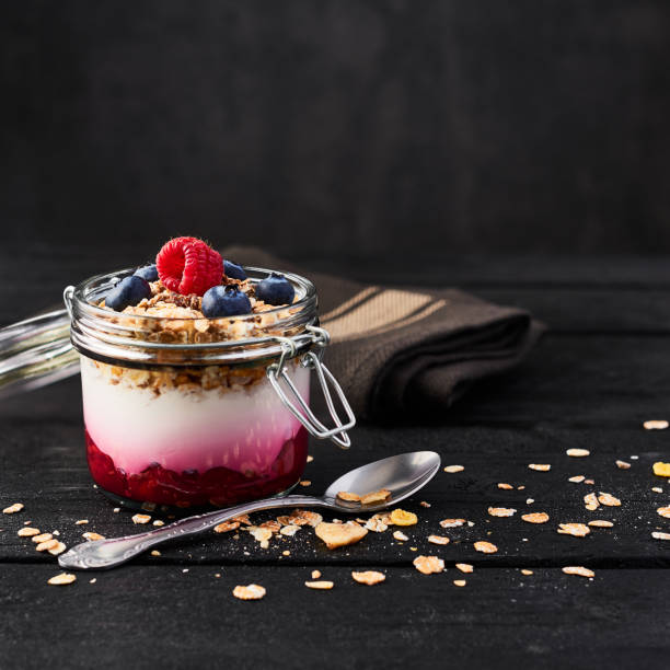istock Yogurt with raspberry sauce, oat and blueberries 1063654818