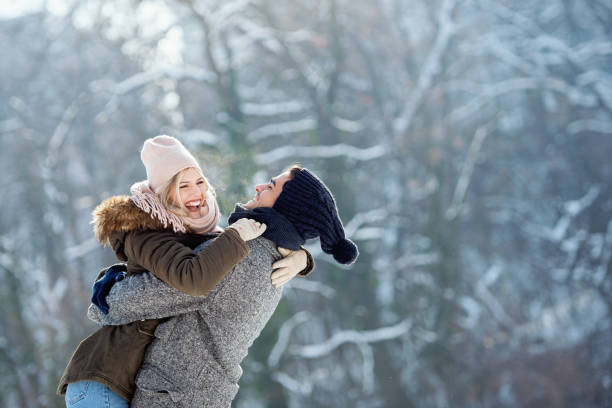istock Two young people enjoying in the snow 1063654856