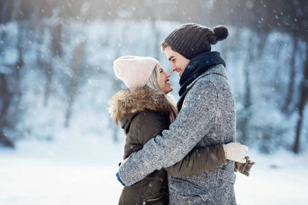 istock Two young people enjoying in the snow 1063656230