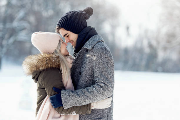 istock Two young people enjoying in the snow 1063656626