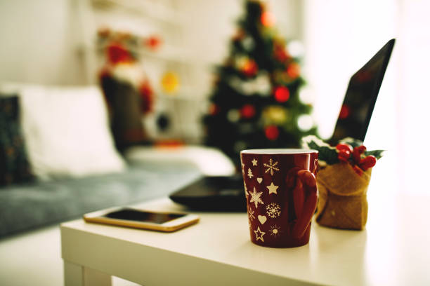 istock Christmas background with cup of coffee and cellphone on the table. 1063656706
