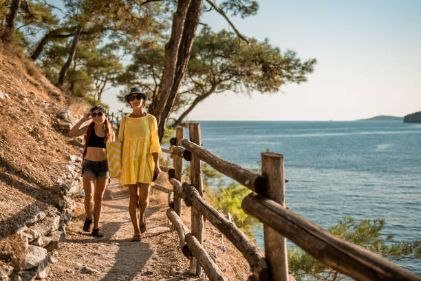 Mother and daughter going to the beach