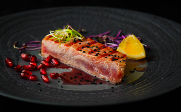 istock Grilled tuna with spices, sauce and sesame seeds 1063657116
