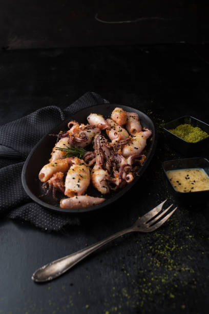 istock Grilled squid in breadcrumbs with lemon 1063657404