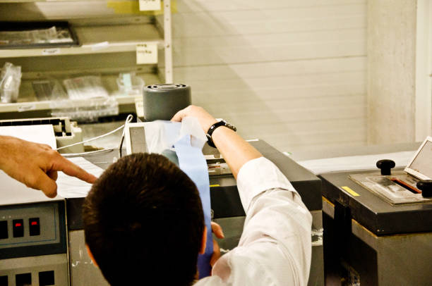 istock Female Engineer (Woman Scientist) Examines a Electronic Sensors In The Laboratory 1063658988