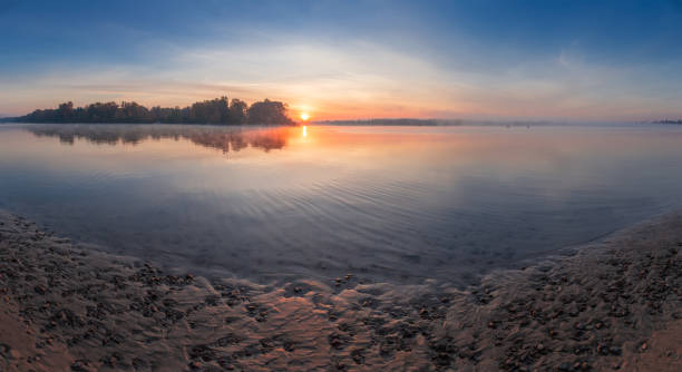 istock Sunrise over the plain river at autumn 1063659542