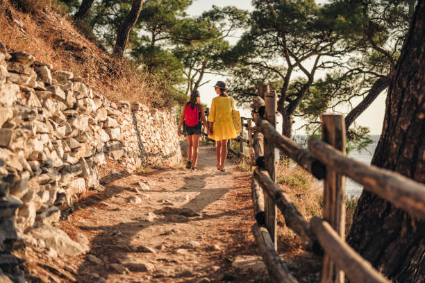 istock Mother and daughter going to the beach 1063661354