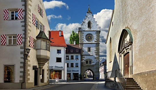 Überlingen, Germany, July 2, 2015: Sunny late afternoon in the picturesque south-German town of Überlingen. With the late Ghotic Franciscan Gate fromfrom 1494. A favorite tourist destination  on the north shore of Lake Constance (Bodensee).