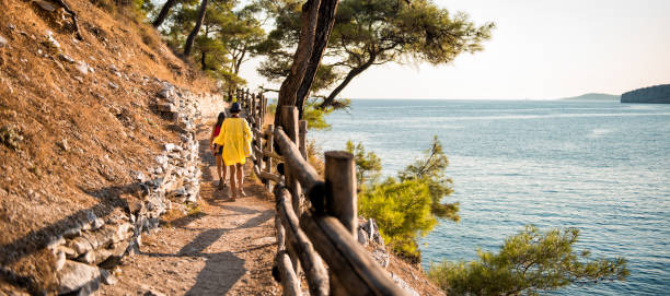 istock Mother and daughter going to the beach 1063665054