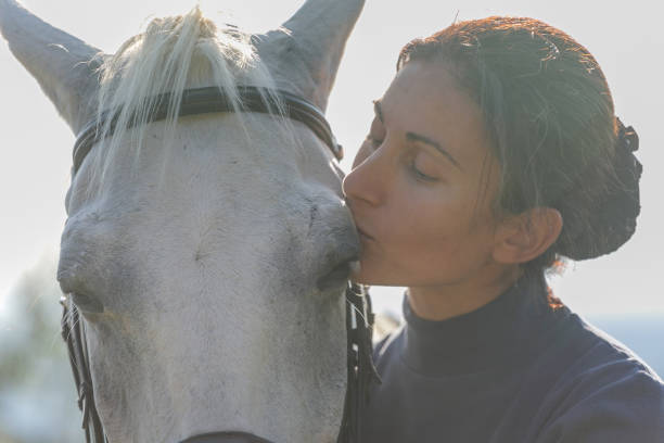 istock Woman bonding with her horse 1063665844