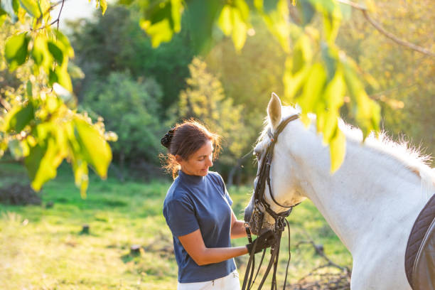 istock Woman with horse on farm 1063665886