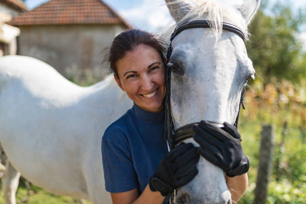 Woman hugging horse