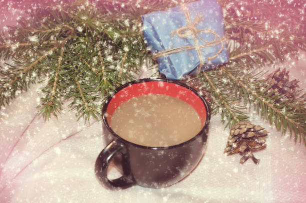 istock cup of coffee, blanket, gift, falling snow 1063668880