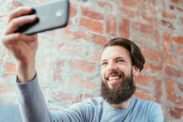 istock man selfie social trend idle leisure vanity photo 1063671596