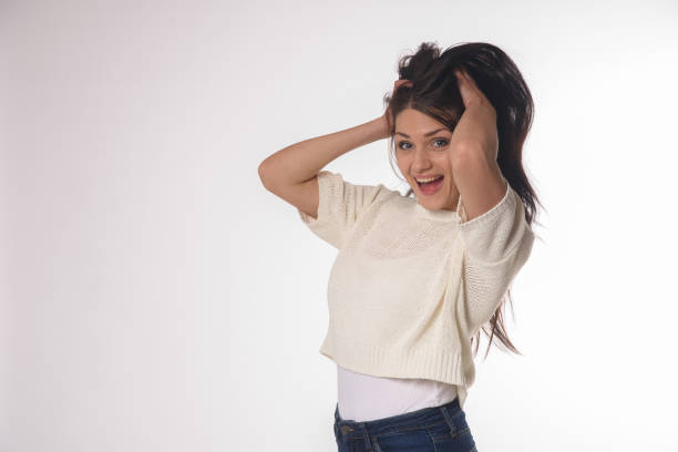 istock White caucasian girl posing emotionally isolated on background 1063673156
