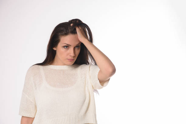 istock White caucasian girl posing emotionally isolated on background 1063673224