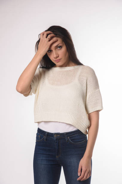 istock White caucasian girl posing emotionally isolated on background 1063673252