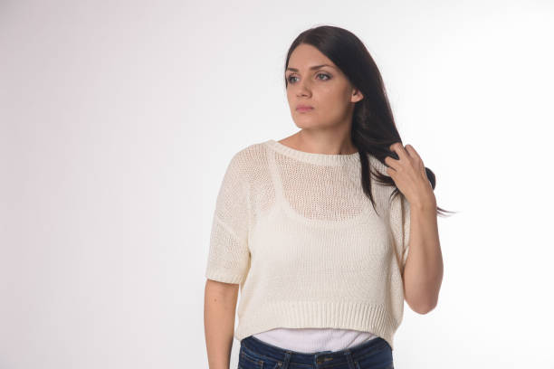 istock White caucasian girl posing emotionally isolated on background 1063673288