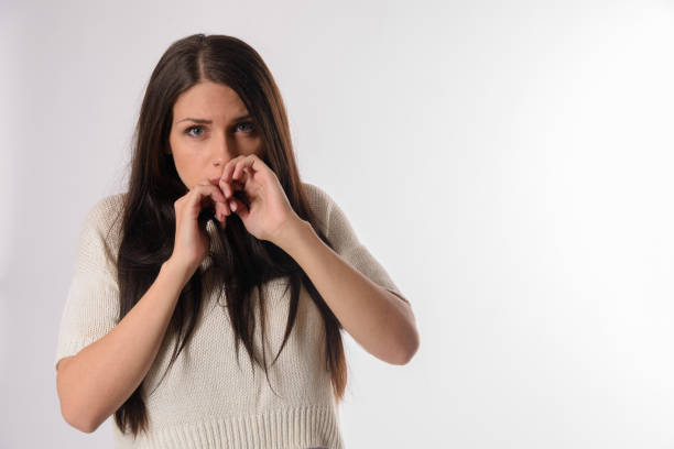 istock White caucasian girl posing emotionally isolated on background 1063673348