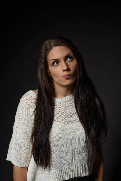 istock White caucasian girl posing emotionally isolated on background 1063673828