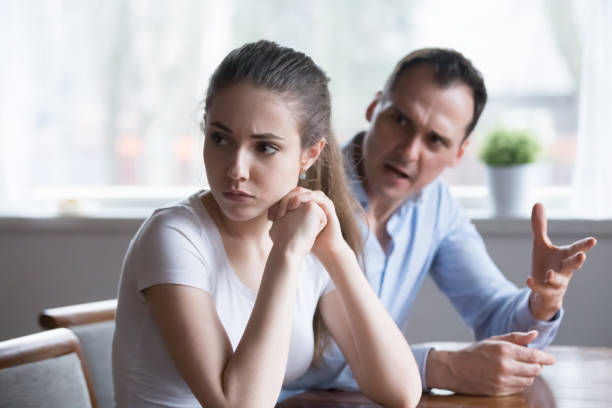 istock Mad man screaming or lecturing offended young lover 1063676618