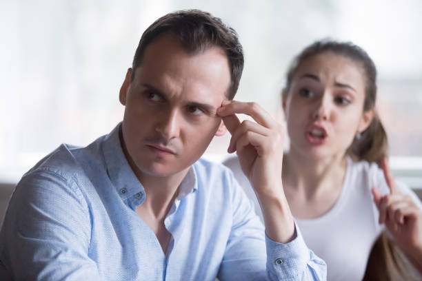 istock Bothering woman lecturing annoyed husband during fight 1063676628