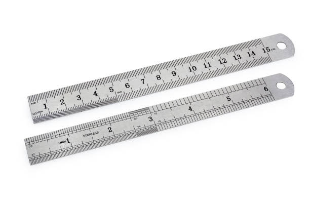 istock Two metal measuring rulers in centimeters and inches 1063676960