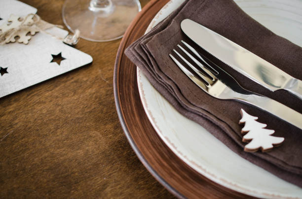 istock Christmas table place setting in vintage or rustic style. 1063680238