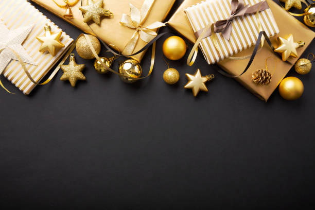 istock Golden golden christmas deco on black 1063680486