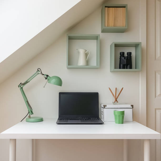 istock Modern workplace interior in cozy attic / loft apartment. 1063682364