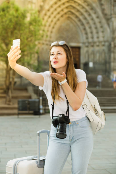 istock Young  traveler walking the city and doing selfie 1063685212