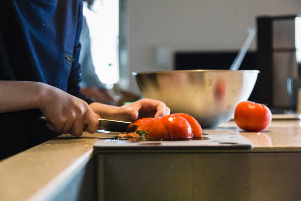 Asian girl cooking in the kitchen.