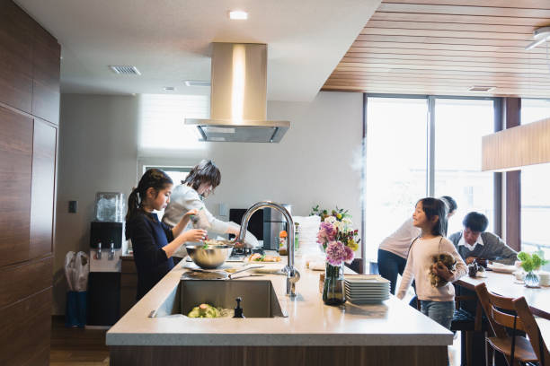 istock Mother and kids in the kitchen 1063686204