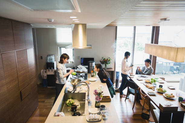 istock Mother and kids in the kitchen 1063686218