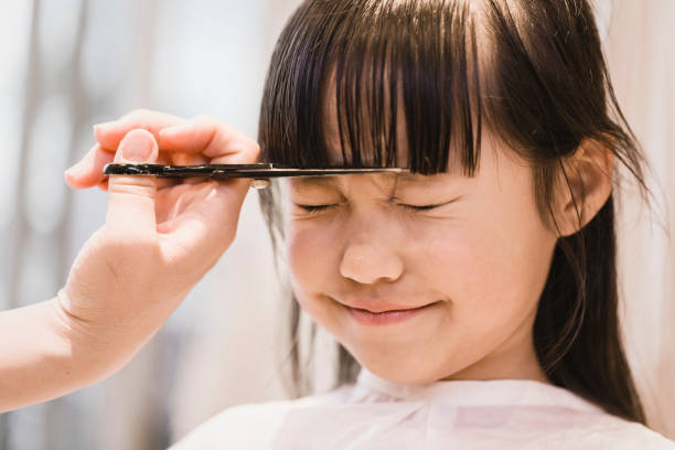 Girl Having Her Hair Cut By Beautician Stock Photo - Download Image Now - Cutting  Hair, Child, Hair Salon - iStock